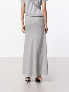 MO&Co. Women's Elasticated Waist Maxi Skirt This flowing maxi skirt is crafted from a soft and breathable cotton blend fabric, making it perfect for warm weather wear. It has a high-waisted design that sits comfortably at the natural waistline, while the A-line silhouette creates a flattering, feminine shape that gently flares out towards the hem. An elasticated waistband ensures a comfortable and flexible fit. Pair this skirt with a tucked-in T-shirt for a chic and put-together look. Features : Cotton Blend Fabric, Weather Wear, Fabric Making, Gray Skirt, Warm Weather, Maxi Skirt, Gray Color, High Waist, A Line