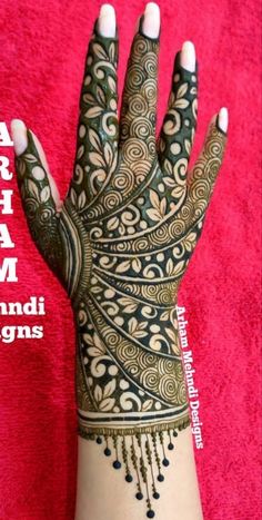 a hand with hendi designs on it