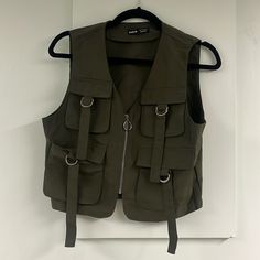 Small Sized Green Cargo Vest From Shein. Four Pockets On The Front. Great Material And Brand New Condition! Packaged In The Original Bag It Came With. Fittwd Vest, Green Hooded Gilet, Heavy Duty Vest, Z Supply Vest, Green Vest Long, Womens Streetwear Vest, Green Long Sleeve White Vest, Vest With Patch Pockets, Wool Vest Jacket