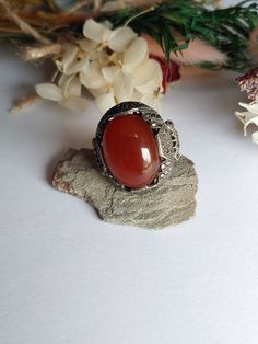 "Vintage 1920s Sterling Silver Art Deco Carnelian & Marcasite Ring Size is right about 5.75\" There is wear from age, please see pictures. **NOTE THAT THERE ARE SOME MISSING MARCASITE STONES**  Basic info: Size- Approx. 5.75\" US Color: Silver / Red Type- Silver work  Cut- Oval weight- approx. 7.8g Silver Mark-  Sterling Maker Mark - N/A  SHIPPING: All orders are guaranteed to ship the same or following day. If your purchase occurs on a Sunday you may request UPS shipment as the post office is closed. Shipping in the United States usually takes 3-4 days" Vintage Filigree Ring With Cabochon, Vintage Oval Cabochon Crystal Ring, Vintage Silver Carnelian Rings, Vintage Oval Crystal Ring With Large Stone, Antique Carnelian Ring As Gift, Antique Carnelian Ring As A Gift, Antique Carnelian Rings For Gifts, Antique Carnelian Ring For Gift, Antique Amber Rings For Collectors