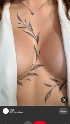 an image of a woman with tattoos on her chest