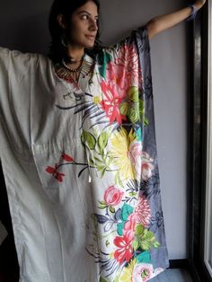 I made this Kaftan from a beautiful Cream and tons of colors 100% mulmul cotton.Mulmul is a very fine variety of cotton which is extremely soft and it gets softer with every wash. It is so free flowing, that it will make you feel as if you aren't wearing anything at all ;) The beauty of the Kaftans is they will fit everyone so no need to worry about the size et all. All my Kaftans have deep necks(11-12 inches) so will fit all head sizes. However, the length of my kaftans will vary. It is 53 inch Multicolor Cotton Maxi Dress For Vacation, Long Multicolor Kaftan For Loungewear, Multicolor Tunic Kaftan For Loungewear, Summer Multicolor Cotton Maxi Dress, Spring Bohemian Kaftan For Home, Multicolor Cotton Kaftan For Loungewear, Multicolor Cotton Kaftan For Lounging, Multicolor Floral Print Kaftan For Loungewear, Multicolor Cotton Kaftan For Festival