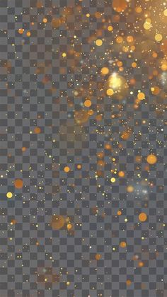 an image of gold glitter on a transparent background, with some blurry lights in the foreground