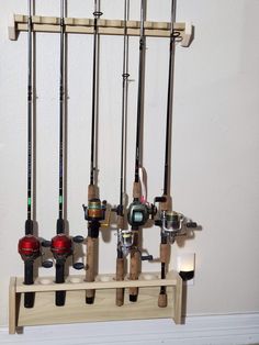 there are many fishing rods hanging on the wall