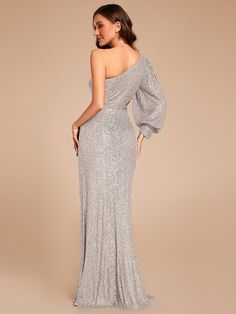 This dress combines sophistication and allure with its asymmetrical one-shoulder style and luxurious sequin fabric. The single long sleeve with a dramatic puff adds a fashionable twist, while the cutout at the waist and thigh-high slit create a flattering and sexy silhouette.
Length: Floor length.
Sleeve Style: Long sleeves.
Closure: It is concealed a zipper up the back.
Undergarments: It is padded, with lining.
Fabric:The garment comprises sequin.
Stretch: Fabric is no stretch. Formal Evening Dress, Ever Pretty, Sequin Fabric, Formal Evening Dresses, Evening Dress, Floor Length, Custom Sizing, Sleeve Styles, Evening Dresses