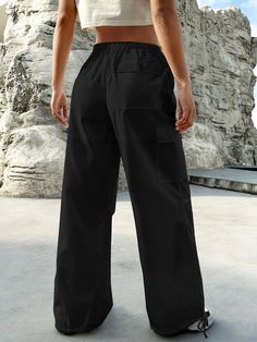 Experience the perfect blend of comfort and style with our Flap Pocket Drop Waist Cargo Pants. These pants are designed for those who appreciate functionality without compromising on fashion. Whether you're exploring the city streets or simply lounging at home, these cargo pants offer versatility for any occasion. Pair them with a casual t-shirt for a laid-back vibe, or dress them up with a button-down shirt for a more polished ensemble. Details: Type: Parachute Pants Closure Type: Drawstring Wa Athleisure Wide-leg Parachute Pants With Pockets, Casual Travel Pants With Pockets, Versatile Straight Leg Yoga Pants With Pockets, Utility Travel Pants With Side Pockets, Utility Bottoms With Pockets For Travel, Casual Cargo Pants With Side Pockets For Travel, Utility Travel Bottoms With Pockets, Travel Pants With Pockets And Relaxed Fit, Casual Cargo Pants For Travel With Side Pockets