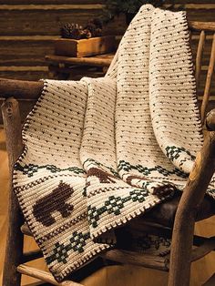 a rocking chair with a blanket on it