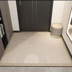 a room with a rug and mirror on the floor