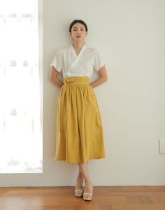 This skirt is a waist skirt with large pockets on both sides.   * 3colors - Mustard & Navyblue & Khaki   * Wrap design waist skirt   * Beautiful Linen design fabric material   * Try match with any other item that you have, they will look great together!   ▶Size    - For the detailed size, please refer to the table in the side menu attached with the picture. ▶Materials  - For more information on the mixing ratio of textiles, please refer to the table in the side menu attached with the picture. ▶M Culotte Skirt, Linen Design, Modern Hanbok, Skirt High Waist, Big Pockets, Korean Traditional, Skirt Vintage, Vintage Linen, Linen Skirt