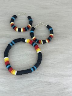 Hi Everyone,  New set in shop, come take a look 👀  Handmade Earrings & Bracelet Set, Black, Red, Orange, Yellow, White, Turquoise Polymer Beads, Silver Small Hoop Earrings, Stretch Bracelet Set. Handmade fashion jewelry accessories perfect simple gifts for her, perfect Mother's Day gifts too.  Can be for everyday look for women and her fashion accessory. The length is about 1.5 inches from top to bottom. The bracelet is 6.5 stretch.  Thank you for looking at my jewelry shop. Beach Jewelry With Black Heishi Beads, Festival Heishi Beads Red Jewelry, Multicolor Hand-strung Beaded Earrings, Red Heishi Beads Jewelry For The Beach, Multicolor Heishi Beads Earrings For Beach, Handmade Red Heishi Beads Jewelry, Polymer Beads, Small Hoop Earrings, Handmade Fashion Jewelry