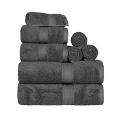 towels stacked up on top of each other in black and grey colors, isolated against a white background