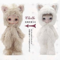 an advertisement with two dolls dressed in animal costumes, one wearing a cat costume and the other as a kitten