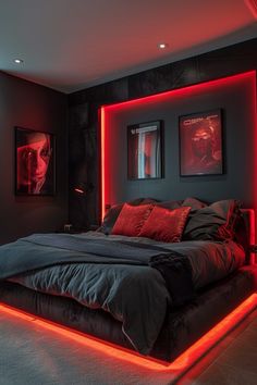 a large bed with red lights on the headboard and foot board in a dark room