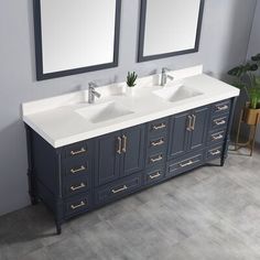 two sinks and mirrors in a bathroom with grey walls, wood flooring and white marble counter tops