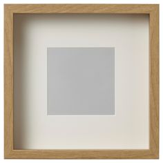 an empty white square in a wooden frame