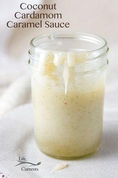 a glass jar filled with coconut caramel sauce