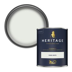 a white paint can with the words heritage on it and an image of a dog