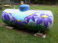 a large tank with flowers painted on it