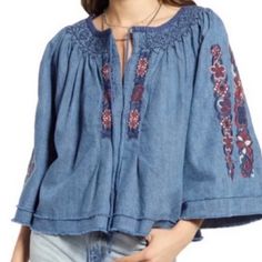 Nwt Embroidered Denim Top, Detailed Embroidery On Bell Sleeves And Neckline, Tie And Hook And Eye Closure At Front, Cropped Style Embroidered Relaxed Fit Top, Embroidered Relaxed Fit Medium Wash Top, Embroidered Medium Wash Tops With Relaxed Fit, Relaxed Fit Embroidered Medium Wash Tops, Embroidered Medium Wash Top With Relaxed Fit, Relaxed Fit Floral Embroidery Tops, Medium Wash Floral Embroidery Top For Fall, Medium Wash Floral Embroidered Tops For Fall, Medium Wash Top With Floral Embroidery And Relaxed Fit