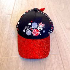 Disney Parks Black And Red Sparkly And Polka Dotted Minnie Mouse Hat With Red Sequin Bow On Back And Adjustable Velcro Closure. Never Worn, In Great Condition Size Youth 54-58cm Questions? Leave A Comment Below! Red Mickey Mouse Adjustable Hat, Black Adjustable Minnie Mouse Hat, Adjustable Black Minnie Mouse Hat, Adjustable Red Mickey Mouse Hat, Disney Junior Mickey Mouse, Girl Baseball Cap, Snow White Seven Dwarfs, Baby Minnie, Pink Minnie