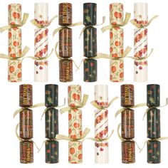 six rolls of candy wrapped in ribbon and decorated with apples, flowers and leaves on white background