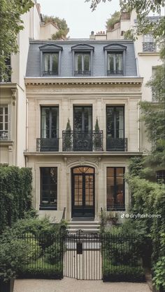 a large house with many windows and balconies