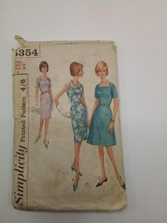 an old sewing book with two women in dresses