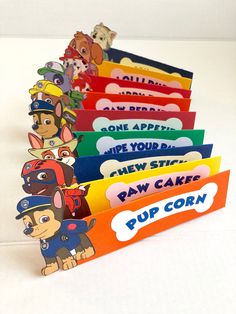 a stack of children's books with cartoon characters on them and the words pup corn