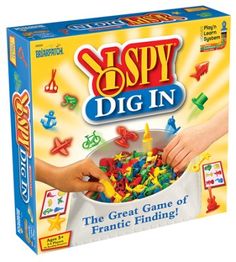 the box for spy dig in is filled with colorful plastic objects and hands reaching into it