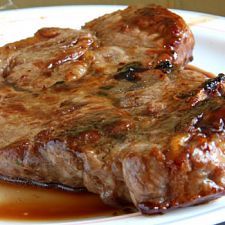 a piece of steak is sitting on a plate