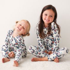 Let your little ones go off to dreamland in style and comfort with these Checkmate Pajamas! Made of super soft bamboo, they'll stay cozy all night long. Sweet dreams little one! 93% Bamboo; 7% Spandex Wash cold with like colors; stays soft wash after wash Fits snug; not treated with flame retardants Soft White Onesie For Playtime, Super Soft White Onesie For Playtime, Playful Super Soft Sleepwear For Bedtime, Cozy White Onesie For Bedtime, Soft Fitted Onesie For Bedtime, Playful Fitted Onesie For Loungewear, Playful Fitted Onesie For Bedtime, Fitted Onesie For Sleepover, Cute Fitted Onesie For Loungewear