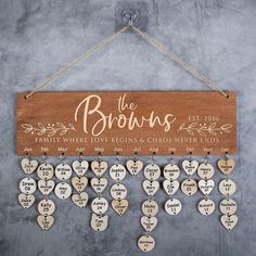 the browns family where love begins and chaos never ends wooden sign hanging on a wall