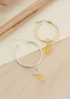 We wanted to add a pop of color to our classic hoops! These gemstone charms come in a pair of two so that you can add them to our classic hoops found here: Etta Hoop Earrings | Women's Gifts | Personalized Gifts | Handmade – Going Golden (going-golden.com) Details: Raw gemstones can vary in size and color, as no two are identical Available in 14K yellow gold-filled or sterling silver designed to fit on our Etta Hoops Hoops are sold separately Handmade in Brownsburg, Indiana Hoop Earrings With Charms For Jewelry Making, Hoop Charms For Jewelry Making, Everyday Hoop Earrings With Charms, Yellow Small Hoop Jewelry For Everyday, Everyday Small Hoop Yellow Jewelry, Everyday Small Yellow Hoop Jewelry, Nickel Free Yellow Hoop Jewelry, Small Hoop Earrings With Dangling Charms In Minimalist Style, Minimalist Small Hoop Earrings With Dangling Charms