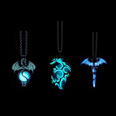 glow in the dark necklaces with dragon pendants on them, glowing blue and green