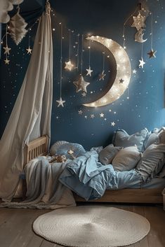 a child's bedroom decorated in blue and white with stars hanging from the ceiling