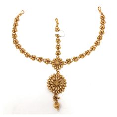 Gold plated ethnic Indian Bollywood tstyle head or hair ornament jewelry. Traditional pear shape with gold bead drop. Attach with bobby pin in the hair. Metal: Alloy Plating: 5K (1gm) Gold Chain Length: 3.25 Inch plus Fish Hook: 0.25 Inch Ornament: Length: 1.94 Inch Width: 1 Inch Gold plated ethnic Indian Bollywood tstyle head or hair ornament jewelry. Traditional pear shape with gold bead drop. Attach with bobby pin in the hair ALL OCCASION - Bridal, Wedding, Party, Dance Dandiya, Garba, Eid, Diwali and Gifts Meticulously Curated and Checked in USA Handcrafted by artisans in India Style Tip: From casual look to bridal wear depending on your style and occasion. Wear it in the center of forehead as shown in the picture Jewelry Care: Can be used in water but dry completely before storing Eth Round Forehead, Forehead Hair, Maang Tika, Jewelry Traditional, Matha Patti, Hair Metal, Bridal Women, Beautiful Flower Designs, Headpiece Hairstyles