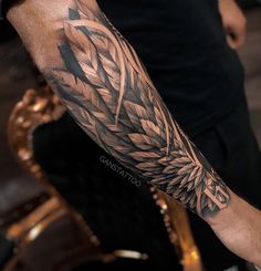 a man with a tattoo on his arm