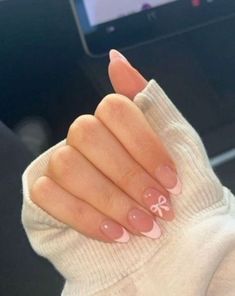 Teens Nails Design, Cute Nails Winter Simple, Pink French Tip Nails With Snowflake, Almond Nails Designs Bow, Winter Basic Nails, Almond Nails Bow Design, How To Do Bows On Nails, French With Bow Nails, Bow Design On Nails