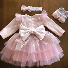 Light pink dress with lace, pearls and bow. Dress with headband and booties with pearls for girl or baby girl. This outfit can be in light pink, ivory and white colors. Lace on a headband may be different from the photo. Can be as first birthday, baptism, christening and flower girl dress. Also it can be as takehome outfit or baby shower gift for baby girl. I can knit a receiving blanket for this outfit if you need. Your girl will have a great look in this outfit. Size in centimeters newborn che Princess-style Baptism Dress With Bow, Elegant Lace Baptism Dress, First Birthday Dress With Lace And Ruffles, First Birthday Lace Dress With Ruffles, Lace Ruffle Dress For First Birthday, Elegant Cream Dress For First Birthday, Elegant Princess Dress With Lace Sleeves For Baptism, Elegant Fitted Pink Baptism Dress, Wedding Princess Dress With Pink Bow