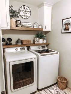 a white washer and dryer sitting in a kitchen next to eachother