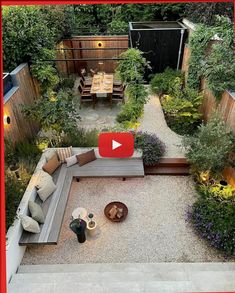 an aerial view of a small backyard garden with seating area and graveled path leading to the back yard