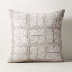 a white pillow with squares on it