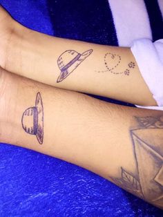 two people with tattoos on their legs