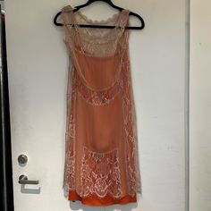 Sleeveless Sheer Nude Lace Dress With Orange Slip. Vintage Sleeveless Silk Slip Dress, Apricot Sleeveless Evening Dress, Vintage Sleeveless Evening Slip Dress, Vintage Sleeveless Slip Dress For Evening, Apricot Sleeveless Midi Dress For Party, Elegant Sleeveless Apricot Midi Dress, Fitted Sleeveless Orange Slip Dress, Fitted Orange Sleeveless Slip Dress, Vintage Beige Sleeveless Midi Dress