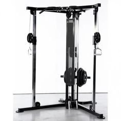 a black and white photo of a squat machine