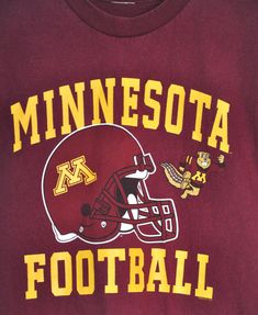 minnesota football t - shirt with helmet on it