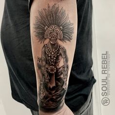 a man with a tattoo on his arm