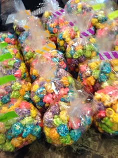 several bags filled with candy sitting on top of a table