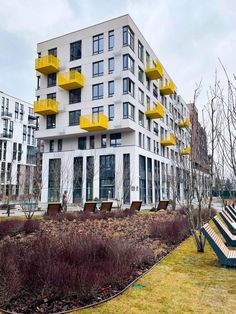 the building has yellow balconies on it