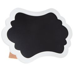 a black and white chalkboard with a wooden sticker in the shape of a flower